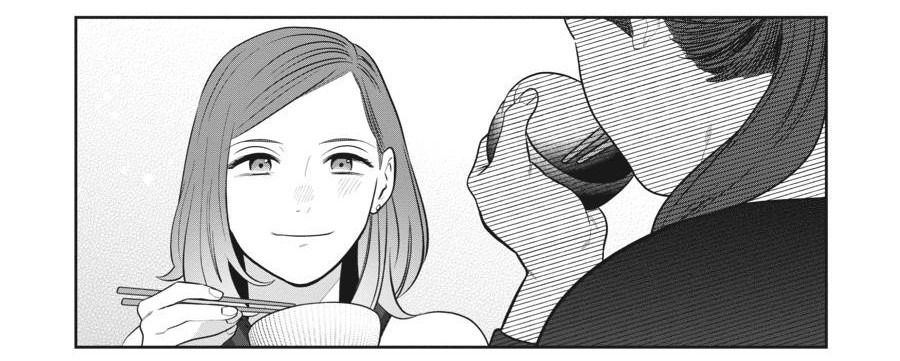 a manga panel showing Nomoto and Kasuga eating together. Nomoto is looking at Kasuga and smiling with faint blush lines over her cheek and nose